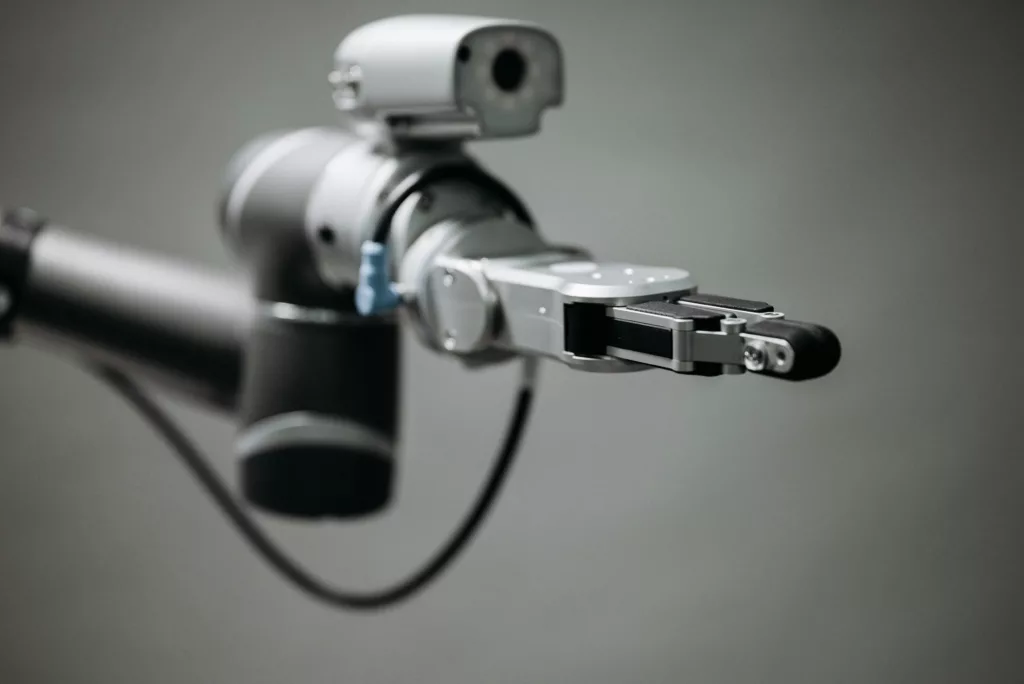 pexels-photo-8439084-8439084 Close-up of a robotic arm showcasing advanced technology and innovation in an indoor environment.